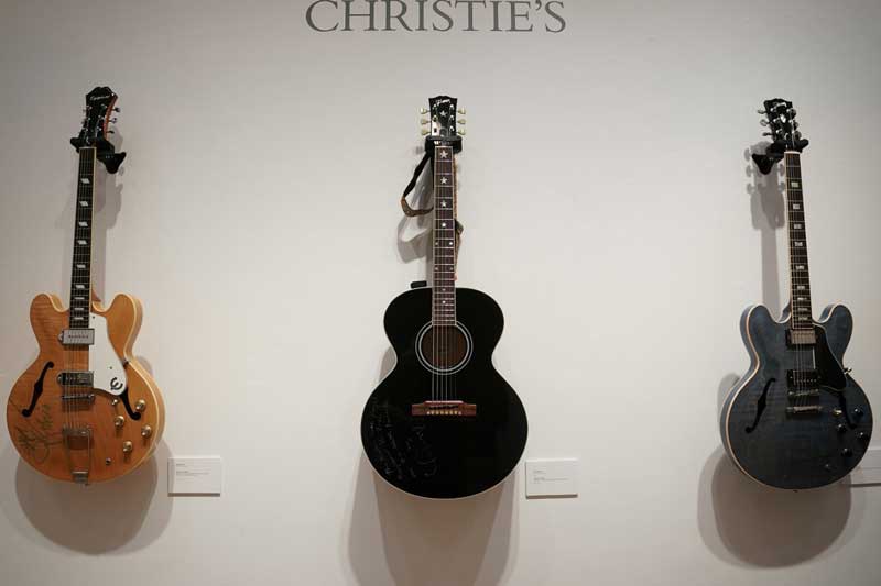 guitar-auction-nashville-bradley-cooper-dolly-parton