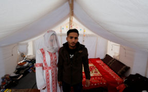 Photographs: A displaced Palestinian couple weds in a tent in Gaza