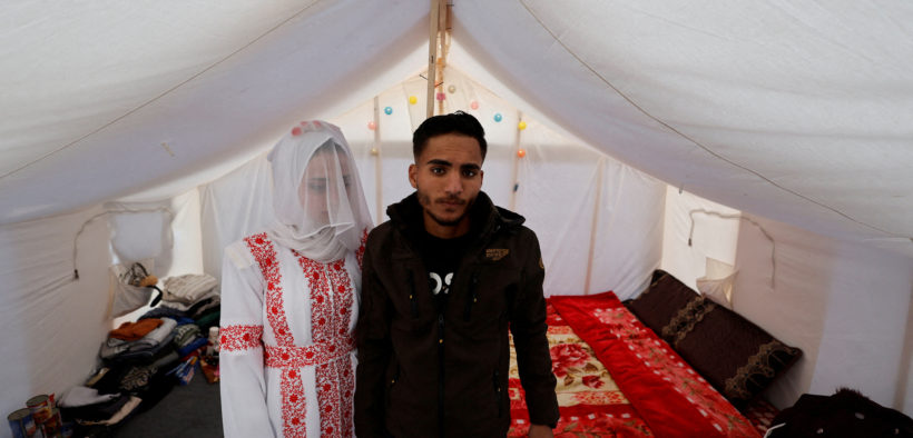 Photographs: A displaced Palestinian couple weds in a tent in Gaza