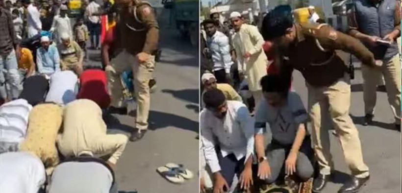 an Indian police officer severely assaults two Muslim men who are praying on Friday
