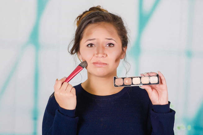 Putting bronzer all over your face