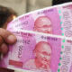 Rupee Weakens to 84.44 Dollar Demand Rises Amid Futures Expiry